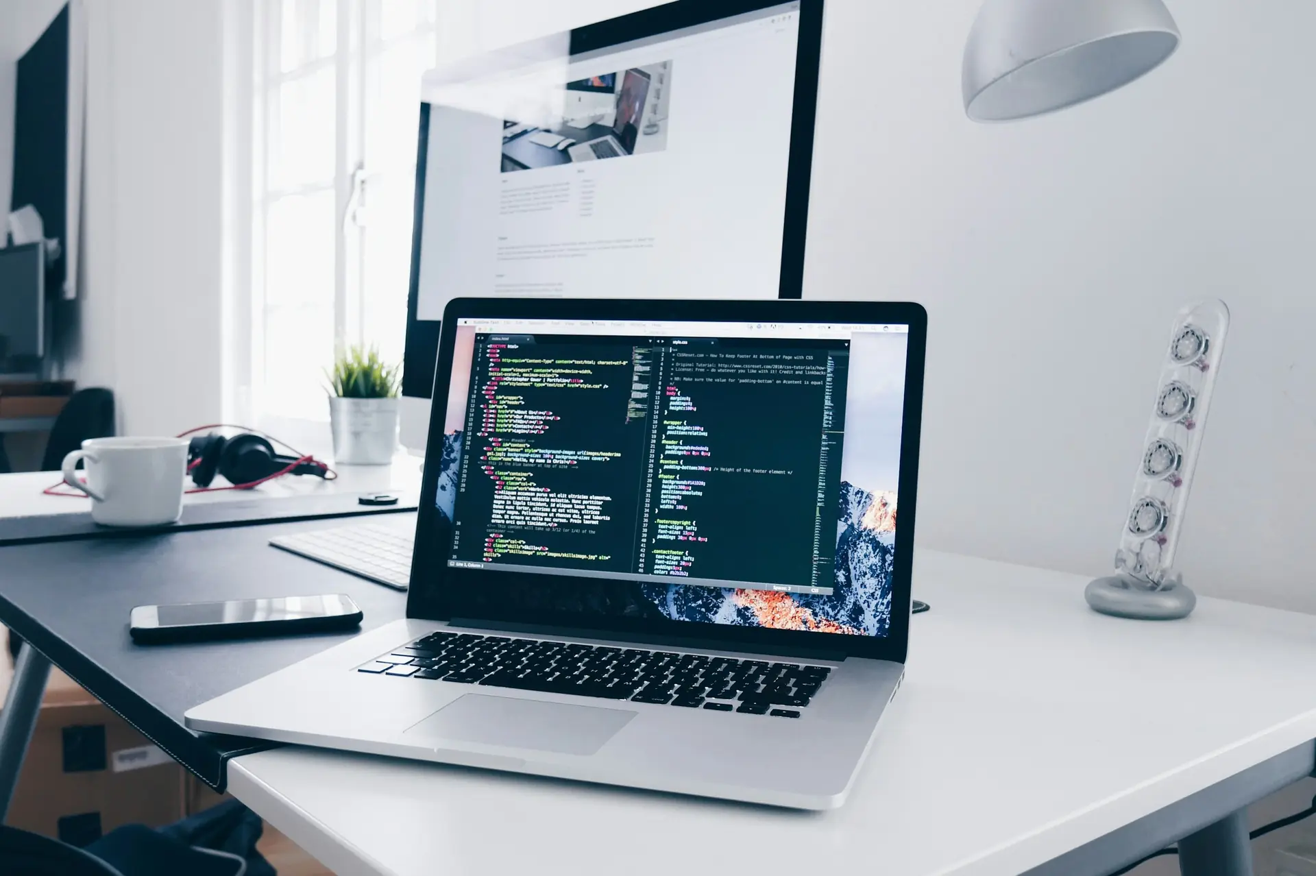 Developer writing code on a MacBook